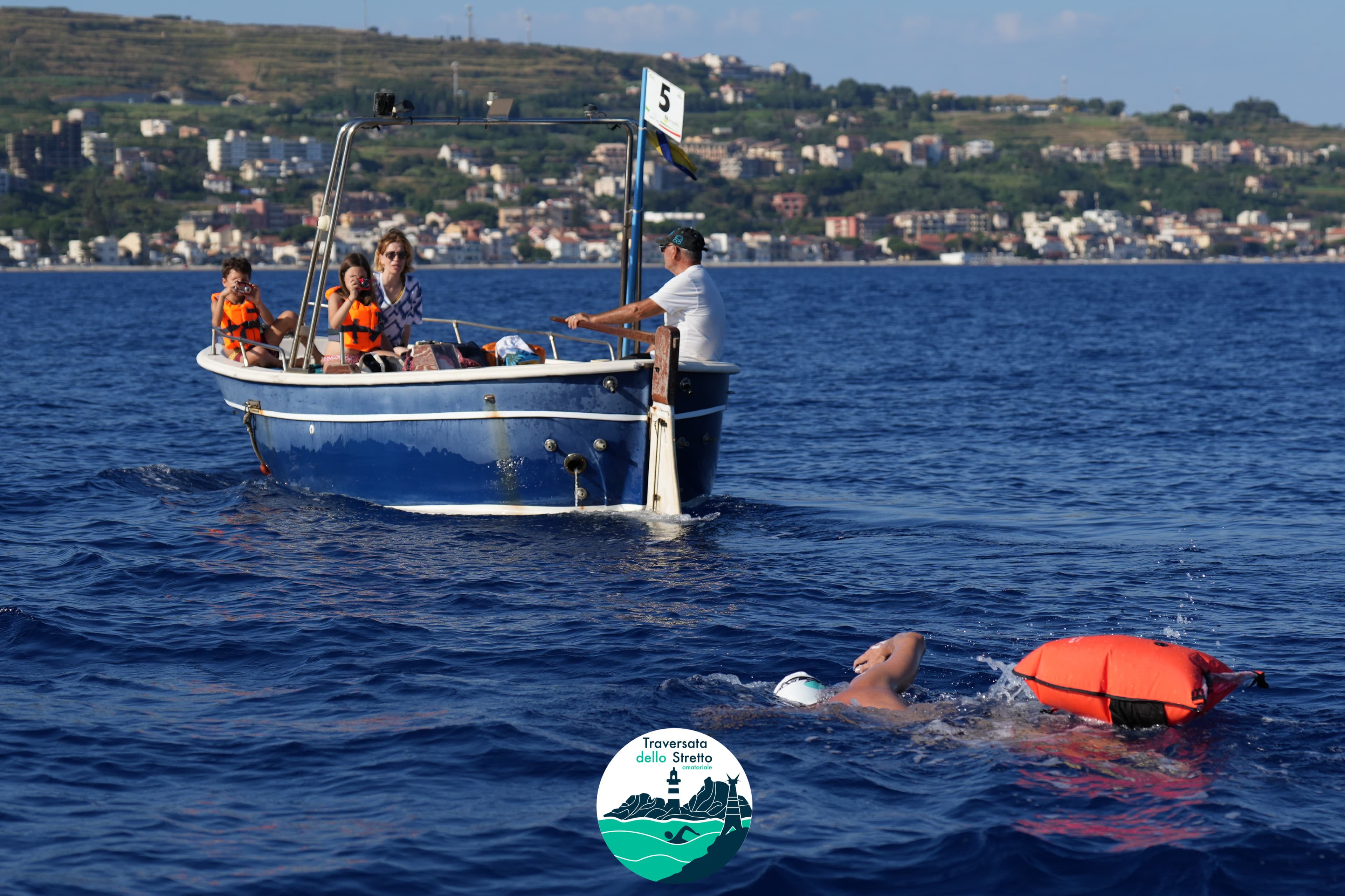 Swimmers with safety buoy